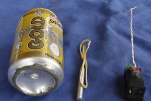 A photo published in Islamic State mag Dabiq reveals a can of Schweppes Gold soda and what looked like a detonator and activate a blue back ground