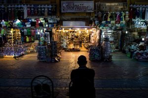 A shop owner waits for customers into the Old marketplace region in Sharm El Sheikh, Egypt