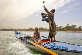 As you cruise, small boats captained by hungry merchants lasso the ship and haggle with individuals while becoming dragged by the ship upstream. I’ll share videos of the amazing stunt on my next post.