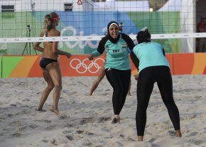 Egypt's Doaa Elghobashy, centre, celebrates a point with teammate Nada Meawad against Canada during beach volleyball play on Thursday in Rio.