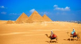 Riding Camels Near the Pyramids