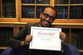 Sem Sem with his certificate, at the ceremony which took place at the Royal Geographical Society