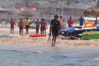 Tunisia gunman regarding the beach where he killed at least 38 tourists